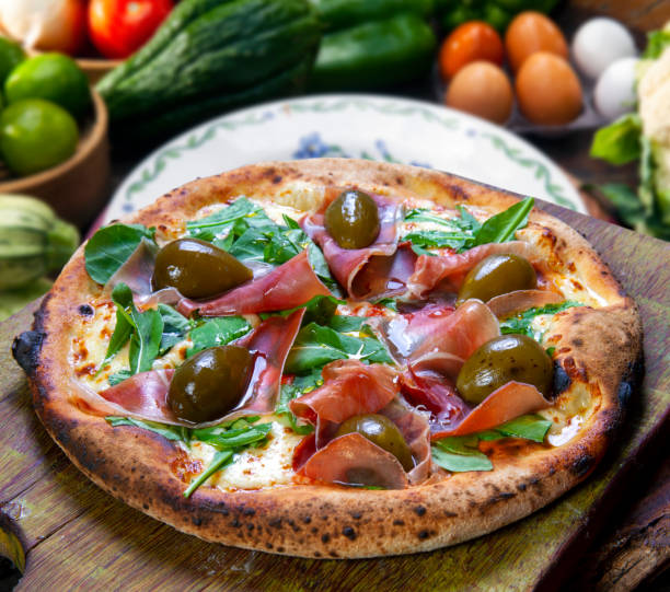 Pizza with Parma ham, figs, rucula and honey