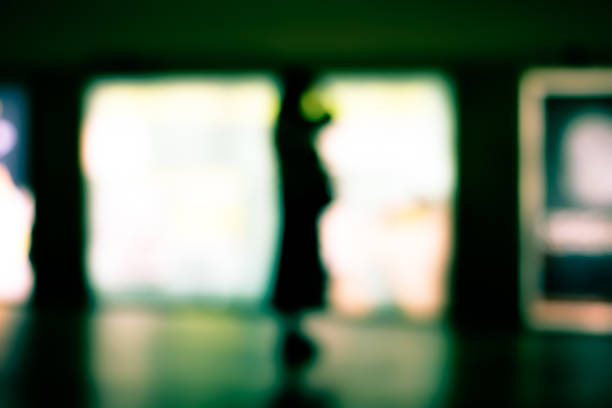 istock Abstract blurry image of a subway platform with human silhouettes. 1434517790