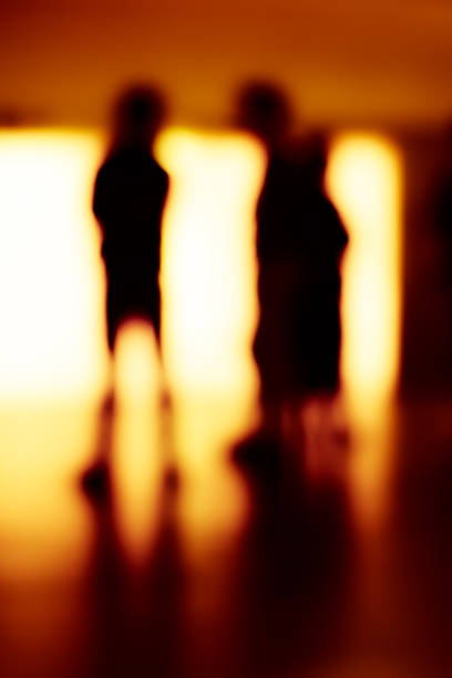 istock Abstract blurry image of a subway platform with human silhouettes. 1434517792
