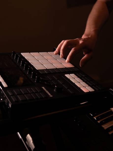 istock Closeup of a sound engineer over a mixing console, a vertical shot 1434517843