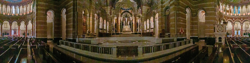 St. Louis, Missouri, USA - September 21, 2022: Sanctuary of The Cathedral Basilica of Saint Louis, also known as the Saint Louis Cathedral, is a cathedral of the Roman Catholic Church located in the Central West End neighborhood of St. Louis, Missouri. The mosaics collectively contain 41.5 million glass tesserae pieces in more than 7,000 colors and cover 83,000 square feet of space. It is the largest mosaic collection in the world outside Russia.