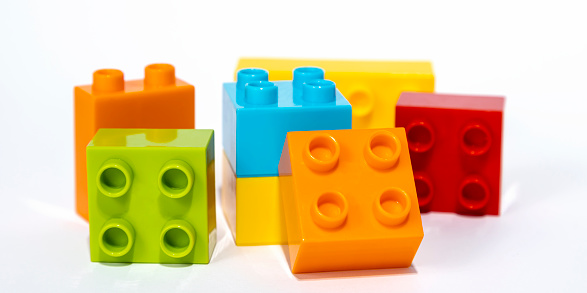 Child development, hand motor skills, colorful blocks of a children's constructor