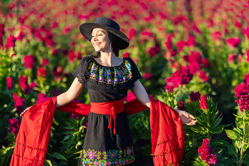 Smiling woman in Michoacan flower fields