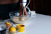 Defocus beating of homemade mayonnaise with olive oil. Mix ingredients for sauce. The chef uses a blender. Step by step sauce preparation. Out of focus