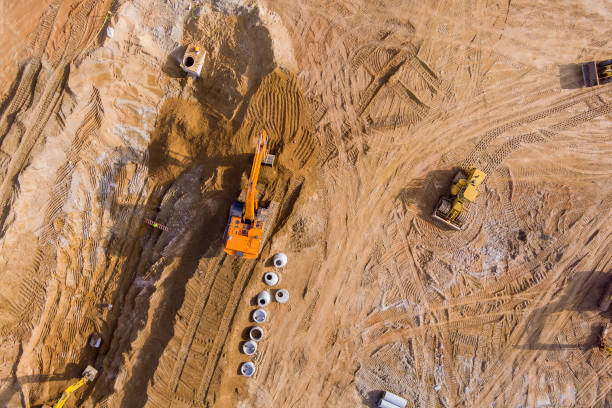 istock A construction site is undergoing construction and an excavator is digging a trench for the laying of sewer lines and the connection of storm sewer pipes underground. 1434526063