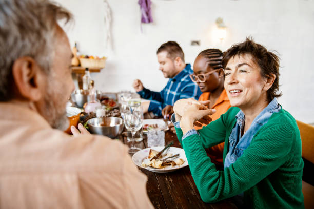 istock Enjoying a family lunch together 1434528732