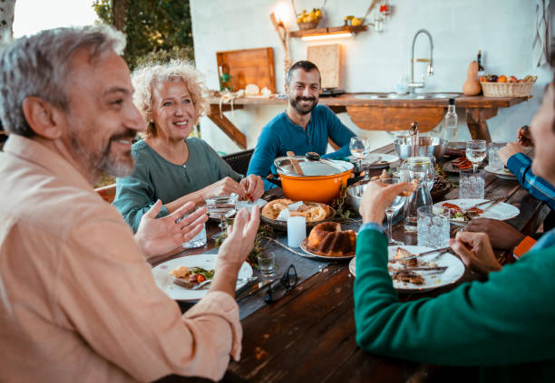 istock Friends around food table 1434528780
