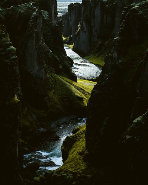 istock Vertical shot of a river flowing between mossy cliffs 1434531183
