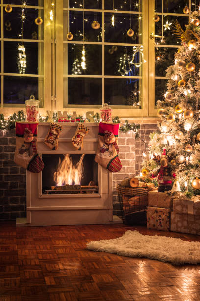 istock Decorated Christmas Tree Near Fireplace at Home 1434532766