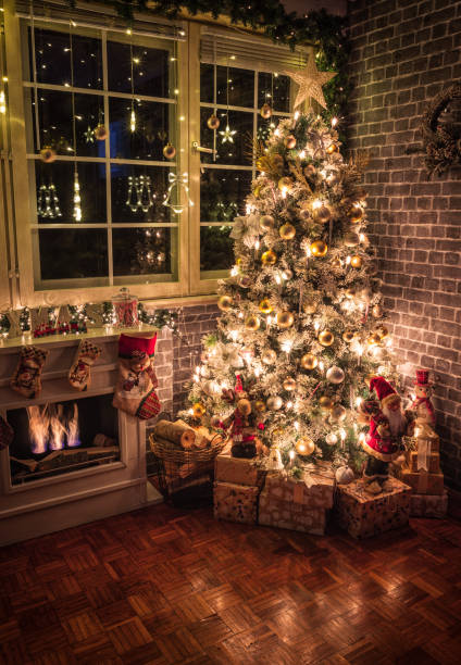 istock Decorated Christmas Tree Near Fireplace at Home 1434532790