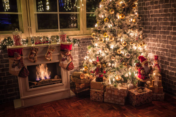 istock Decorated Christmas Tree Near Fireplace at Home 1434532794