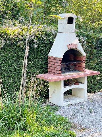 Outdoor stove can be used as a pizza oven or as a grill for a variety of meats and vegetables.