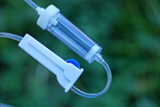 istock part of a white medical dropper with a small empty plastic container 1434537555