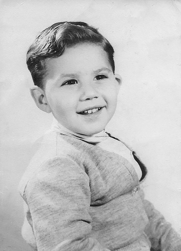 Black and white Image from the fifties, smiling little boy portrait