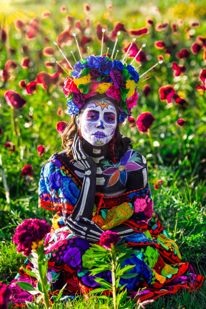 istock Mysterious catrina among red flowers 1434544825