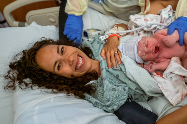 istock Joyful woman holding her newborn baby 1434552013