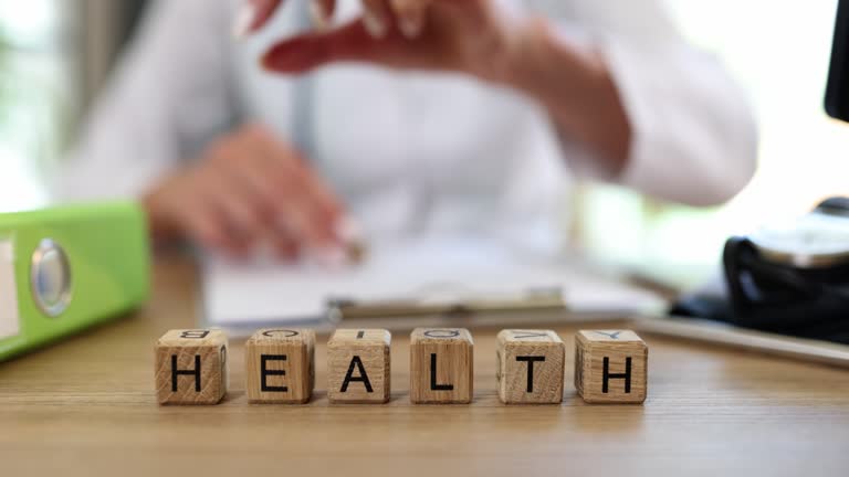 Health and wealth on cubes on the doctor's table, close-up