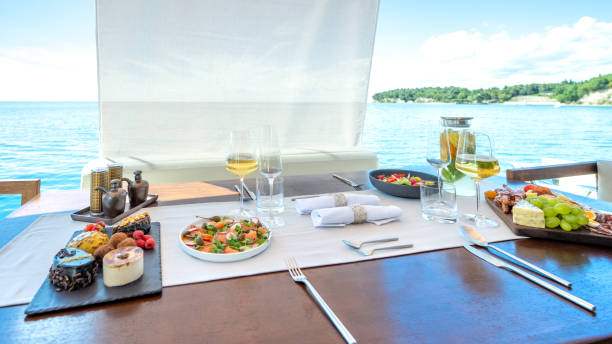 istock Table with varied tasty snacks on yacht deck 1434556189