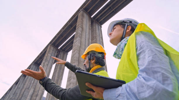 istock Road engineers working. Building new highways. 1434558639