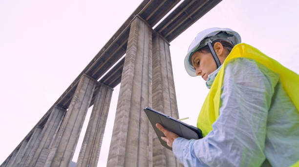 istock Female road engineer working. Building new highways. 1434558640