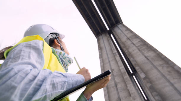 istock Female road engineer working. Building new highways. 1434558645