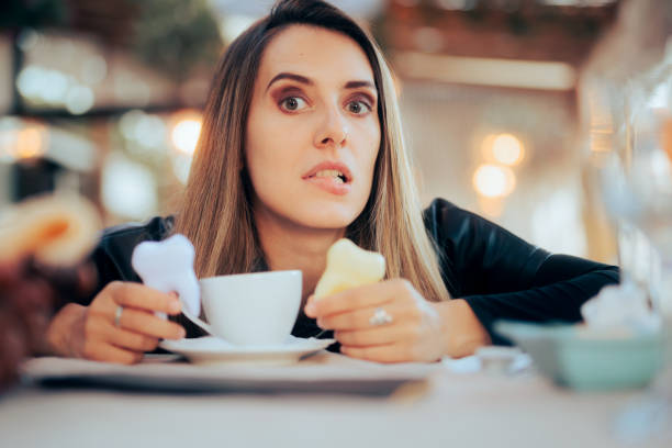 Worried Woman Having Teeth Coloration problems from Coffee stock photo