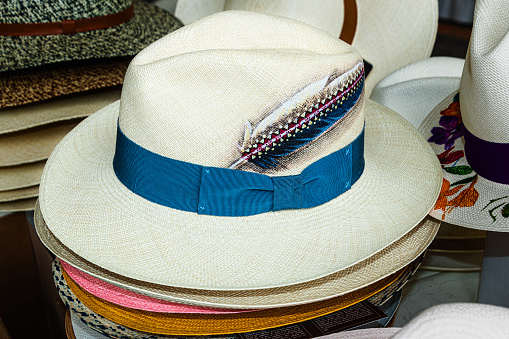 Authentic Ecuadorian handmade Panama hat or Paja Toquilla hat made of straw with feather design on it. Panama is a popular souvenir from Ecuador.