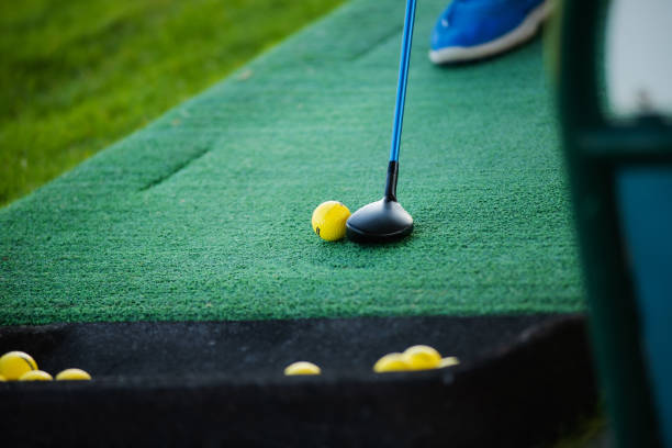 istock Golf club and ball on green grass, close-up 1434565325