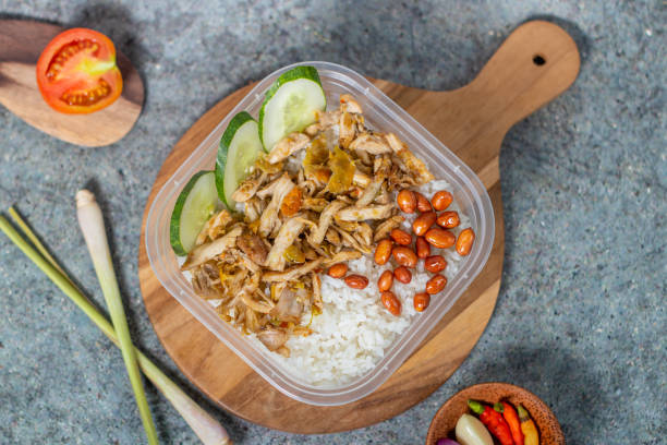 istock rice bowl with spicy chicken and fried peanuts with cucumber 1434571368