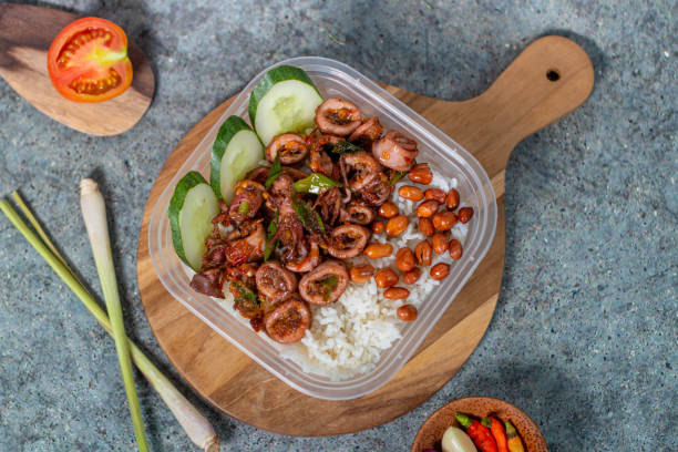 istock rice bowl with spicy squid and fried peanuts with cucumber 1434571437