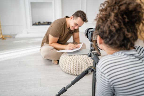 istock artist couple making video blog or course record instruction on camera 1434572729