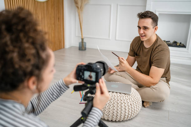 istock artist couple making video blog or course record instruction on camera 1434573079