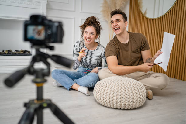 istock artist couple making video blog or course record instruction on camera 1434573100