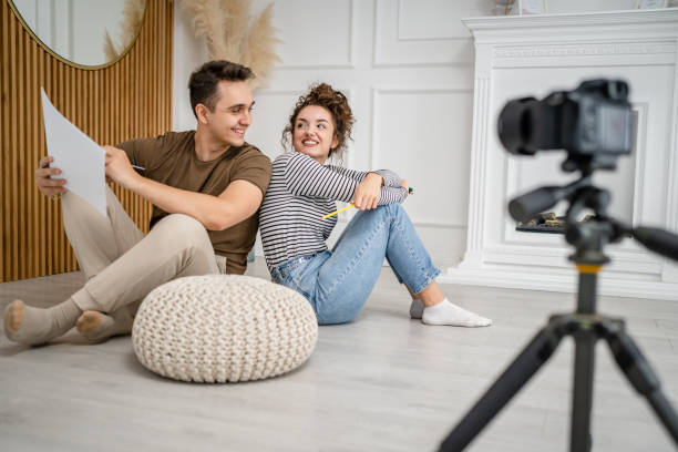 istock artist couple making video blog or course record instruction on camera 1434573235