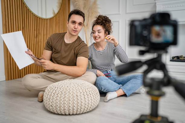 istock artist couple making video blog or course record instruction on camera 1434573352