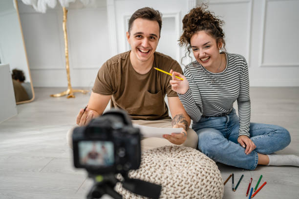 istock artist couple making video blog or course record instruction on camera 1434573357