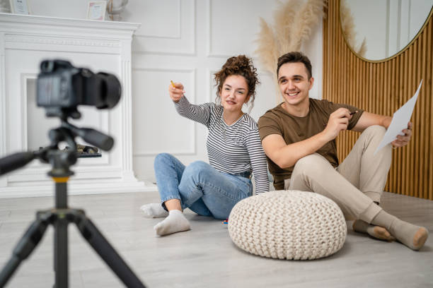 istock artist couple making video blog or course record instruction on camera 1434573358
