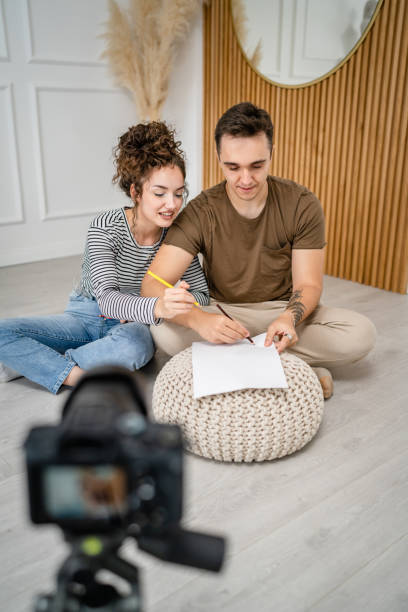 artist couple making video blog or course record instruction on camera