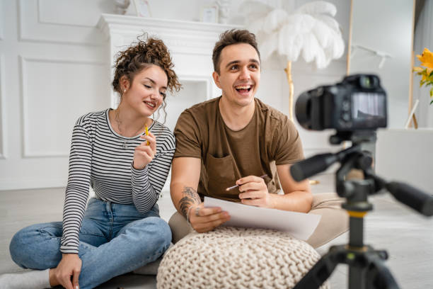 istock artist couple making video blog or course record instruction on camera 1434574456