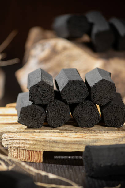 istock charcoal briquettes medium size tube made from 100% selected coconut 1434579167