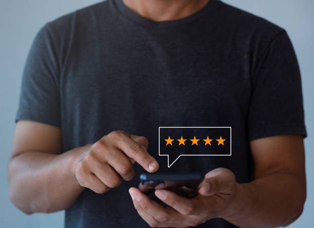 istock Customer review satisfaction feedback survey concept, Man give a rating to service experience on online application, Customer can evaluate quality of service leading to reputation ranking of business. 1434586417