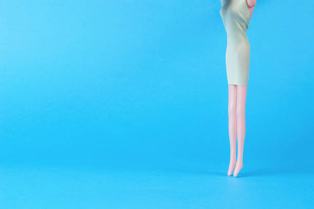 istock Slender girl doll on a light blue background. 1434588726