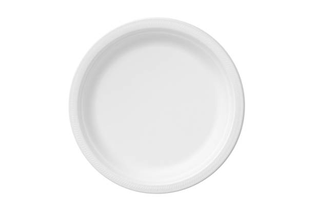 Round disposable polystyrene foam (Styrofoam) plate, isolated on white background.