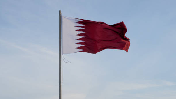 istock qatar flag flying high in the wind.. 1434591301