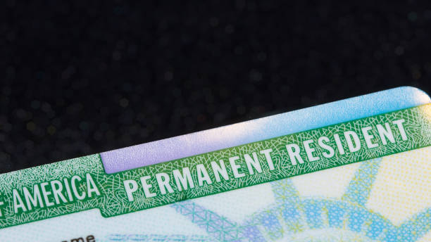 istock Top corner of a US permanent resident card (commonly known as Green Card). 1434592873