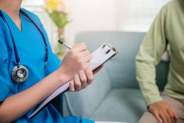 istock Asian young nurse writing prescription during home visit sick elder old man 1434595001
