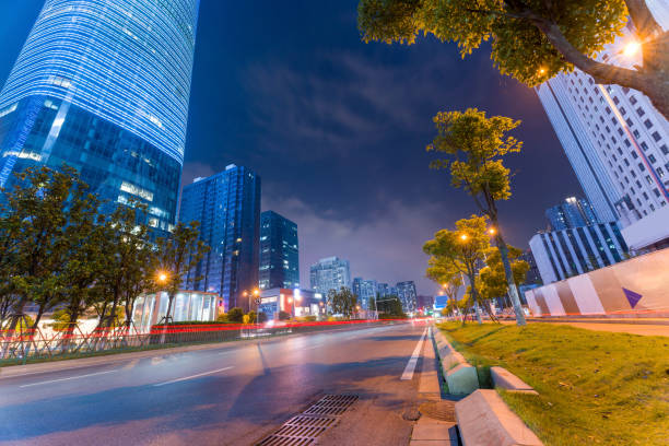 istock the light trails on the modern building background in shanghai china 1434596897