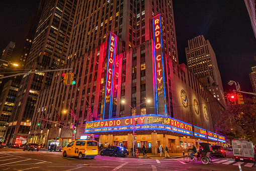 Street view of Radio City Music Hall at night in New York City