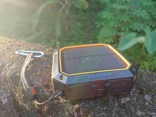 istock photo charging process Power Bank sollar cell or panel from direct morning sun shine 1434601325