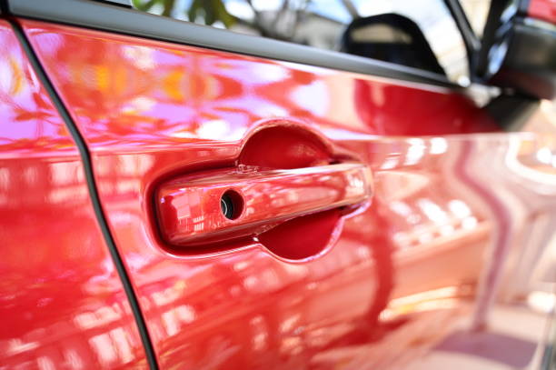 istock door handle of red car, transpotation industry 1434601777